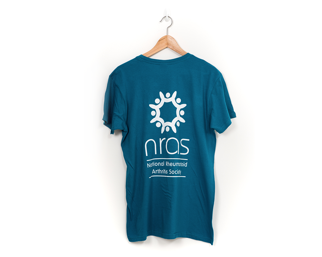 The back of a teal and white NRAS T-shirt with a large NRAS logo