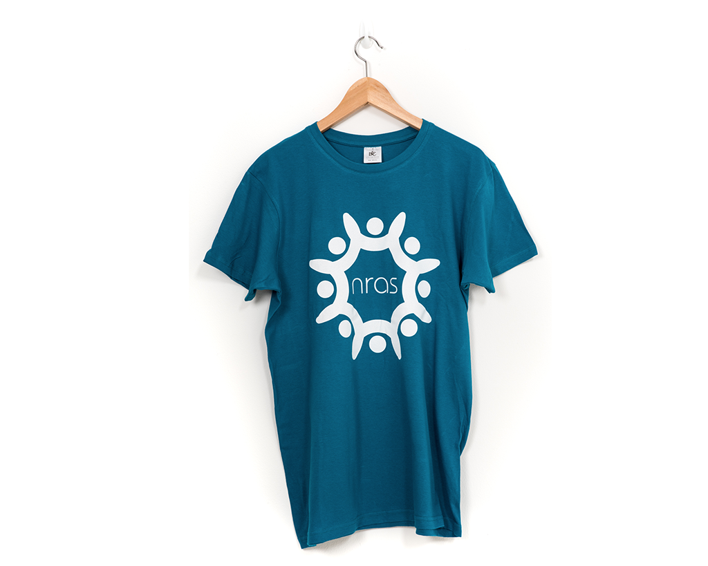 The front of a teal and white NRAS T-shirt with a large NRAS logo